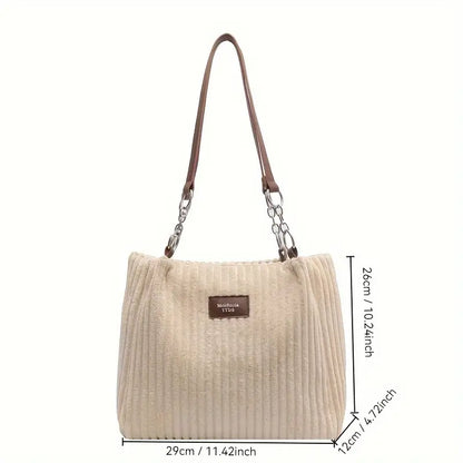 Alvhilde | Borsa morbida con texture a coste e elegante catena in metallo