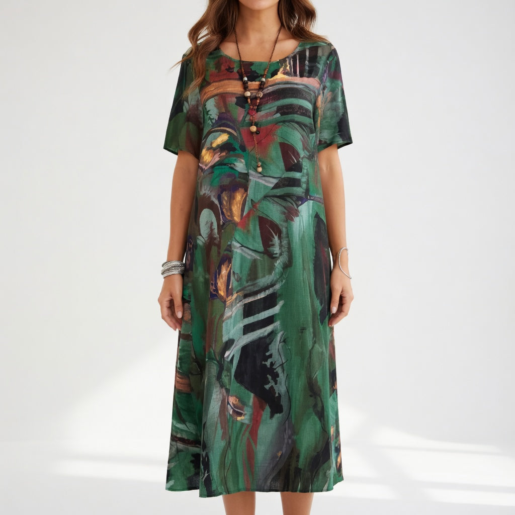 Abito lungo fluido con stampa artistico — Eleganza boho estivo